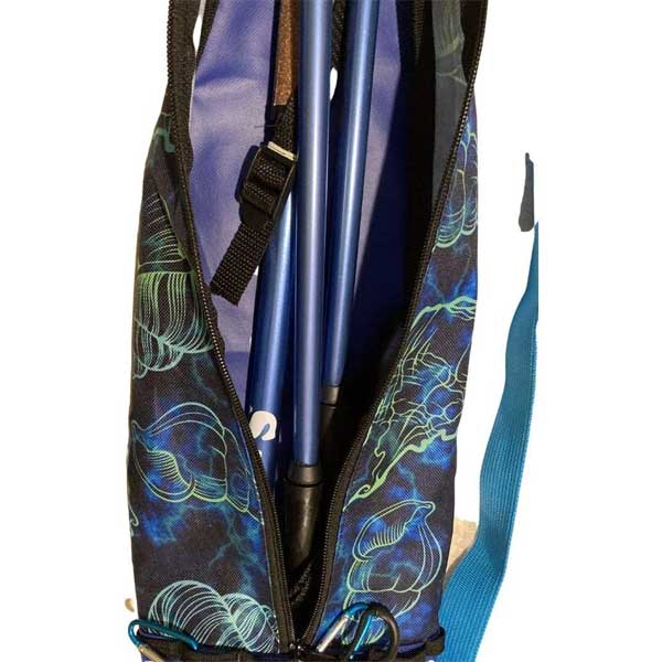 Blue bag in a patterned carrying case on a white background