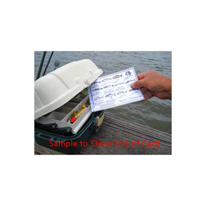 Card held up to a boat on a dock with water in the background