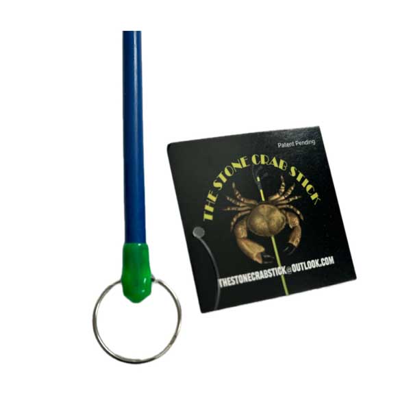 Blue and green stick with a keychain attachment and packaging on a white background