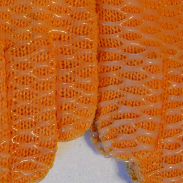 Close-up of orange textured fabric on a white background