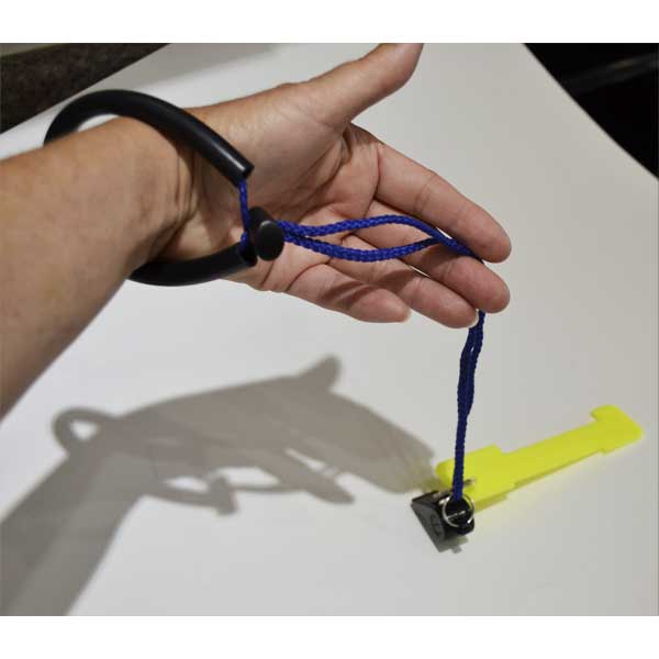 Hand holding a blue lanyard with a black whistle and lobster gauge on a white surface