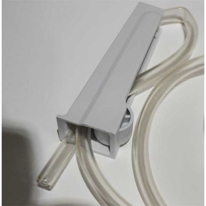Gray plastic component with clear tubing on a light gray background