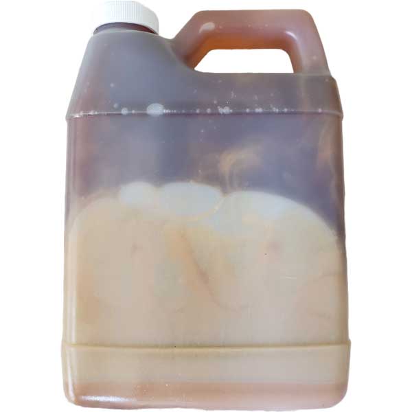 Clear plastic container with a pink handle on a white background