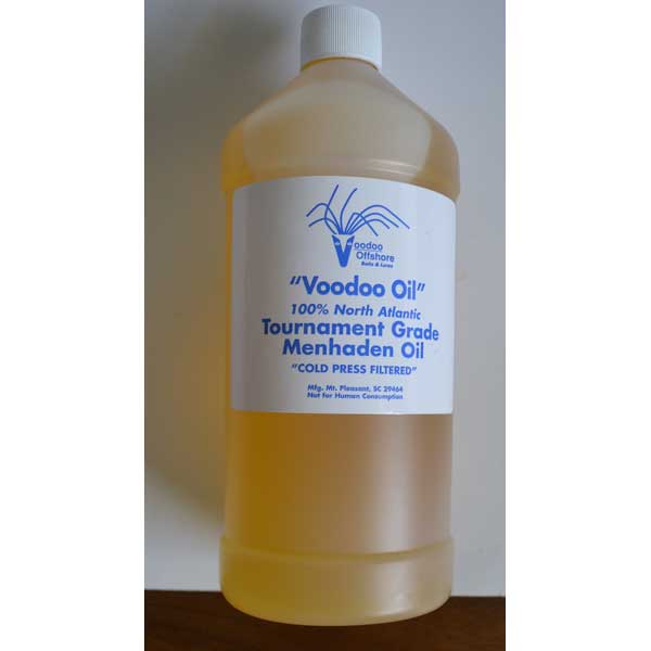 Bottle of Voodoo Oil with a label on a plain background