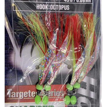 Fishing lure with colorful fibers and green base, packaging visible