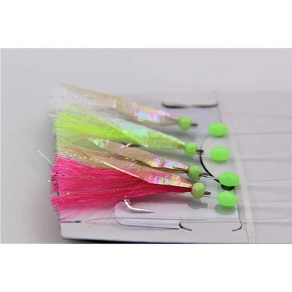 Fishing lures with pink and green colors on a white background