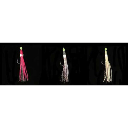 Three fishing lures in pink, white, and beige on a black background