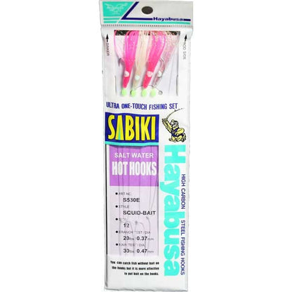 Packaged Sabiki fishing hooks with colorful shad bodies on a white background
